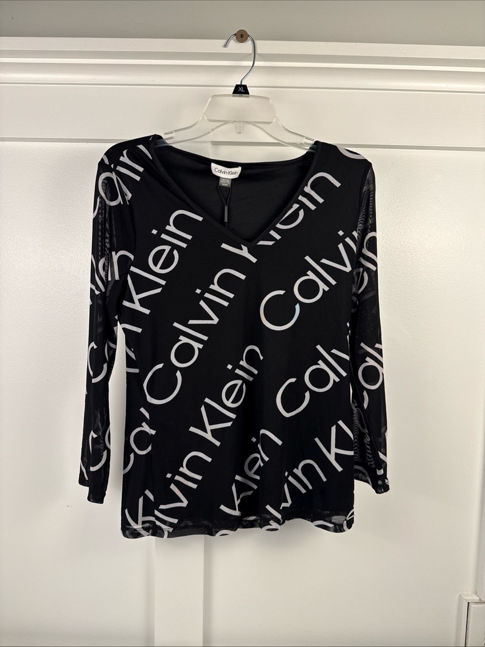 Calvin Klein Black Long Sleeve V-Neck Top with White Logo Print woman’s size M
